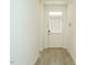 Bright entryway featuring light wood floors and a white door with glass and blinds at 120 Wise Oak Ln, Garner, NC 27529