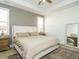Spacious main bedroom with large bed, ceiling fan, and neutral colors at 120 Wise Oak Ln, Garner, NC 27529
