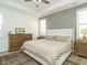 Spacious main bedroom with large bed, ceiling fan, and neutral colors at 120 Wise Oak Ln, Garner, NC 27529