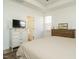 Bedroom featuring a dresser, TV and ensuite bath at 120 Wise Oak Ln, Garner, NC 27529