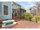 A large back deck features a built-in hot tub for relaxation, perfect for unwinding outdoors at 1217 Hillingdon Way, Raleigh, NC 27614
