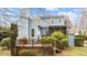 Spacious backyard with a deck, mature trees, and a shed provides a serene and private outdoor setting at 1217 Hillingdon Way, Raleigh, NC 27614