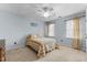 Well-lit bedroom with carpet, two windows and ceiling fan at 1217 Hillingdon Way, Raleigh, NC 27614