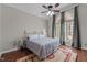 Cozy bedroom featuring hardwood floors, a large window, and a comfortable bed at 1217 Hillingdon Way, Raleigh, NC 27614