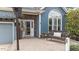 Inviting front porch with brick paving, bench seating, and stone accents creating a welcoming entrance at 1217 Hillingdon Way, Raleigh, NC 27614