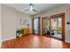 Open living area with hardwood flooring, natural light, and access to screened porch at 1217 Hillingdon Way, Raleigh, NC 27614