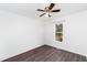 Bedroom with a ceiling fan, wood floors, a window, and white walls at 12491 Buffalo Rd, Archer Lodge, NC 27527