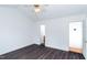 Spacious bedroom featuring wood floors and a door leading to the bathroom at 12491 Buffalo Rd, Archer Lodge, NC 27527