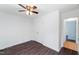 Bedroom with wood floors, a ceiling fan, a closet, and access to the bathroom at 12491 Buffalo Rd, Archer Lodge, NC 27527