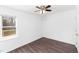 Bedroom featuring wood floors, a ceiling fan, a window, and access to a deck at 12491 Buffalo Rd, Archer Lodge, NC 27527
