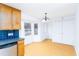 Eat-in kitchen featuring wood cabinets, stainless dishwasher, and a bright breakfast area at 12491 Buffalo Rd, Archer Lodge, NC 27527
