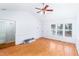 Open-concept living room offering hardwood floors, white walls, and plenty of natural light at 12491 Buffalo Rd, Archer Lodge, NC 27527