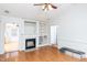 Inviting living area with hardwood floors, a fireplace, and open access to other rooms at 12491 Buffalo Rd, Archer Lodge, NC 27527