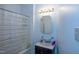 Bathroom with shower curtain, mirror, and vanity at 1805 Shelton Ave, Durham, NC 27707