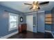 Comfortable bedroom featuring a closet, chest of drawers, and ample natural light through a large window at 1805 Shelton Ave, Durham, NC 27707