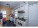 Functional kitchen with natural light, white cabinets, and range cooktop at 1805 Shelton Ave, Durham, NC 27707