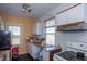 Functional kitchen with natural light, white cabinets, and room for cooking appliances at 1805 Shelton Ave, Durham, NC 27707