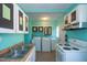 Functional laundry room with modern washer, dryer, and cabinetry, perfect for efficient home management at 1805 Shelton Ave, Durham, NC 27707