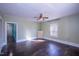 A spacious living room featuring hardwood floors and ample natural light, perfect for relaxation and gatherings at 1805 Shelton Ave, Durham, NC 27707
