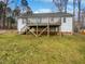 Backyard with wooden deck and lush green grass at 20 Beechnut Ct, Franklinton, NC 27525