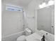 Well-lit bathroom features a shower/tub combo and modern finishes at 20 Beechnut Ct, Franklinton, NC 27525