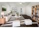 Bright living room boasts neutral colors and vaulted ceilings, showcasing a modern aesthetic, virtually staged at 20 Beechnut Ct, Franklinton, NC 27525