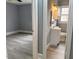 Bathroom with white sink, toilet, cabinets, and neutral paint color scheme at 201 W Thorndale Dr, Oxford, NC 27565