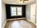 Bedroom with gray and blue walls, ceiling fan and wood-look flooring at 201 W Thorndale Dr, Oxford, NC 27565