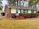 Exterior elevation showcasing updated landscaping and stairs at 201 W Thorndale Dr, Oxford, NC 27565