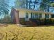 Charming single-story home featuring a brick facade, well-maintained lawn and inviting front entrance at 201 W Thorndale Dr, Oxford, NC 27565