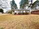 Charming home featuring a manicured lawn and brick accents at 201 W Thorndale Dr, Oxford, NC 27565