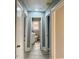 Hallway featuring light gray walls and doors leading to various rooms at 201 W Thorndale Dr, Oxford, NC 27565