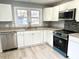 Renovated kitchen with new appliances and granite countertops at 201 W Thorndale Dr, Oxford, NC 27565