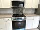 Kitchen boasting stainless steel appliances and granite countertops at 201 W Thorndale Dr, Oxford, NC 27565