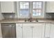Bright kitchen featuring stainless steel appliances, light countertops and cabinetry at 201 W Thorndale Dr, Oxford, NC 27565