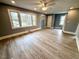 Open-concept living room with wood-look floors and neutral paint at 201 W Thorndale Dr, Oxford, NC 27565