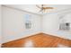 Spacious bedroom features gleaming hardwood floors and natural light from dual windows, creating a bright and inviting space at 202 W Lavender Ave, Durham, NC 27704