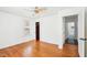 Bright bedroom features hardwood floors, window and ceiling fan at 202 W Lavender Ave, Durham, NC 27704