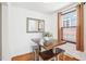Cozy dining area featuring seating for four, wood floors, and lots of natural light at 202 W Lavender Ave, Durham, NC 27704