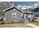 Charming single story brick home with manicured lawn, walkway, and front door at 202 W Lavender Ave, Durham, NC 27704