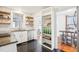 Beautiful kitchen with white cabinets, stainless steel appliances, and open shelving at 202 W Lavender Ave, Durham, NC 27704