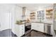 Bright kitchen with stainless appliances, granite countertops, and subway tile backsplash at 202 W Lavender Ave, Durham, NC 27704