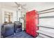 Updated laundry room features laundry machines and a set of red lockers at 202 W Lavender Ave, Durham, NC 27704