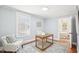 Bright home office with a classic wooden desk, comfortable seating, and natural light, perfect for productivity at 202 W Lavender Ave, Durham, NC 27704