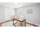 Comfortable office featuring a wooden desk, large window, light blue walls, a chair and patterned rug at 202 W Lavender Ave, Durham, NC 27704