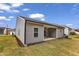 The home features a pristine backyard with a covered patio area for relaxation and outdoor enjoyment at 203 Jetson Creek Way, Youngsville, NC 27596