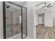 Modern bathroom features a glass-enclosed shower with tile surround at 203 Jetson Creek Way, Youngsville, NC 27596