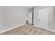 Bright, carpeted bedroom with neutral walls, two interior doors, and crisp, white trim at 203 Jetson Creek Way, Youngsville, NC 27596