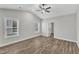 Primary bedroom with vaulted ceilings, vinyl floors, and natural light at 203 Jetson Creek Way, Youngsville, NC 27596