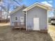 Exterior view of the house featuring a wooden deck and a fenced yard at 265 Freeman Pines Pl, Fuquay Varina, NC 27526